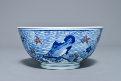 A rare Chinese blue and underglaze red bowl with carps and marine animals, Xuande mark, Kangxi